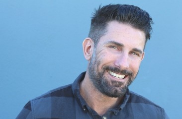 Man with short beard smiling