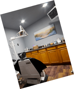 Dental treatment room with painting of pond on wall