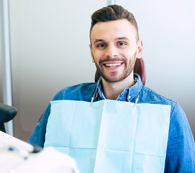 Man with brilliant white smile after teeth whitening in Edmond, OK