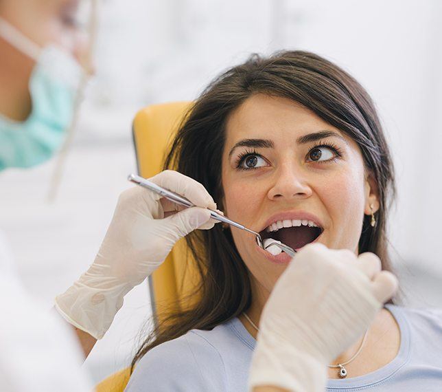 Dentist performing wisdom tooth extraction
