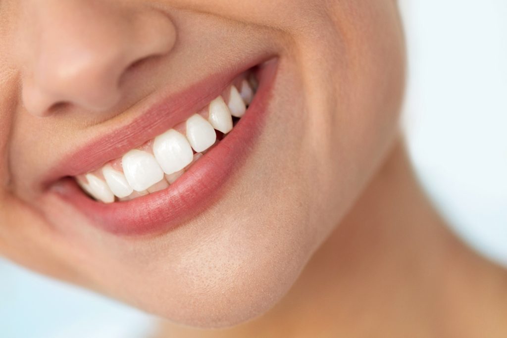 Closeup of woman's white, healthy teeth