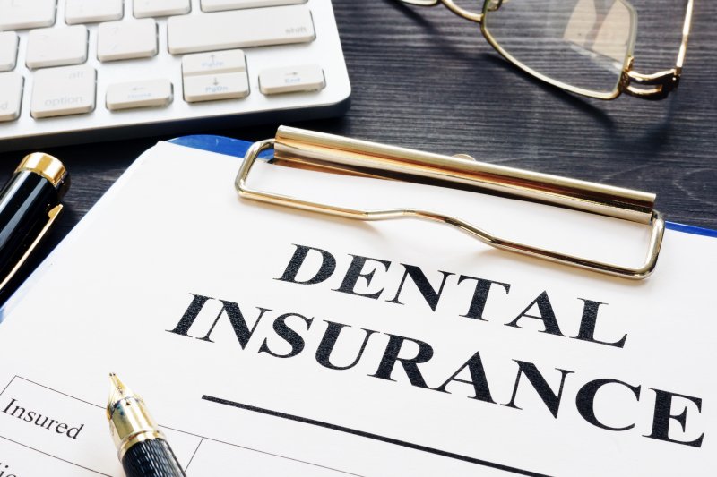 Dental insurance paperwork on clipboard
