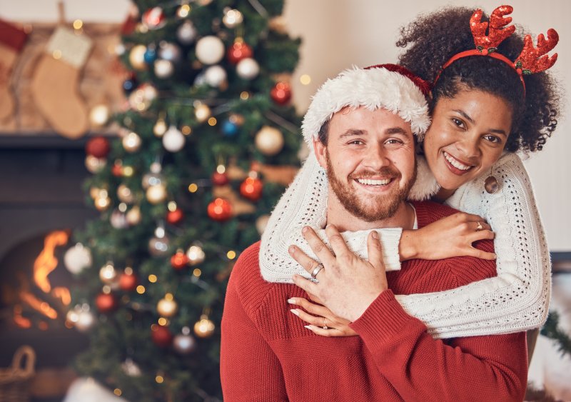 happy couple with straighter teeth during the holidays